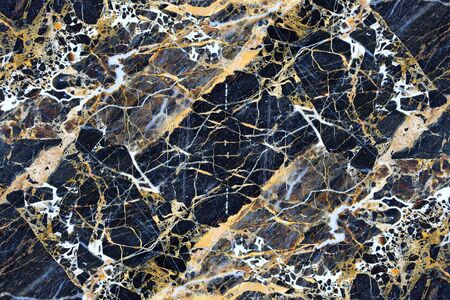 Yellow pattern structure of dark marble pattern for background.の写真素材