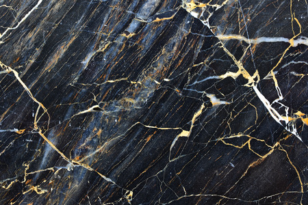 Gold yellow patterned natural of dark gray marble pattern for texture and designの写真素材