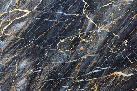 Gold color pattern of dark marble pattern for background and design.の写真素材