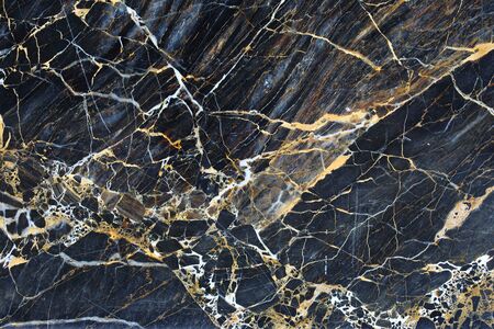 Gold patterned natural of dark marble pattern background texture.の写真素材