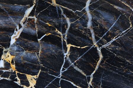 Gold and white patterned structure of dark gray marble pattern texture.の写真素材