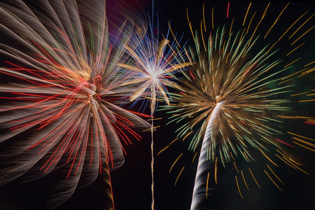 Colorful fireworks of various colors over sky at night background.の写真素材
