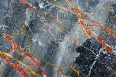 Gold and red patterned structure of dark gray marble pattern (Russia Gold) texture for design.の写真素材