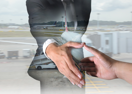 Businessman will handshaking for business relationship and airport on motion background as Transportation, Commitment and Partnership concept.の写真素材