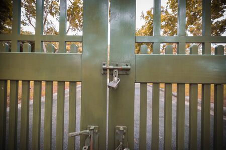 Lock on the gate, shadow vintage door or retro style