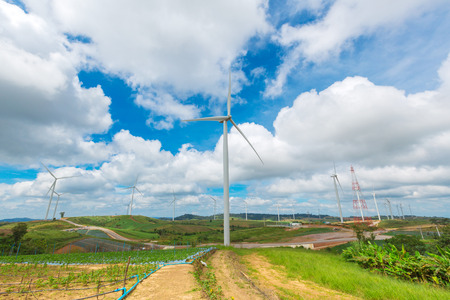 Huge wind turbine under clouds and blue sky, beautiful nature and Renewable power background