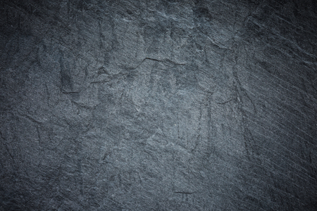 Dark grey and black slate background or textureの写真素材