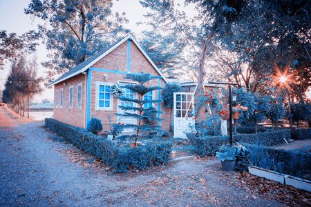 Authentic old house with glass wooden door and window, retro sepia toned imageの写真素材