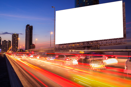 blank billboard on light trails, street and urban in the night - can advertisement for display or montage product or businessの写真素材