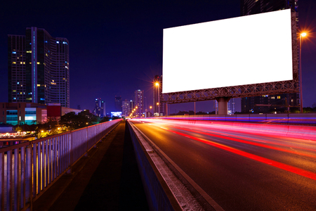 blank billboard on light trails, street and urban in the night - can advertisement for display or montage product or businessの写真素材