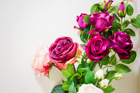 rose flower plastic on white wallpaper backgroundの写真素材