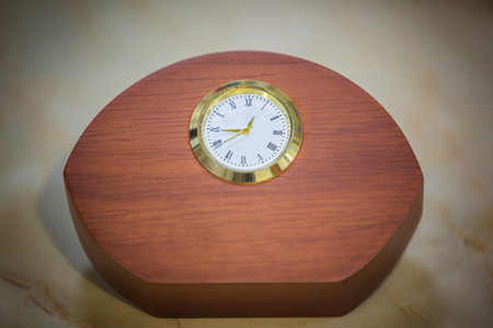 Luxury golden clock in hardwood. Best accessories background.の写真素材