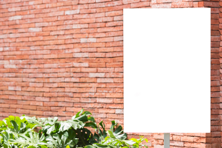 white blank billboard on brick wall background - can advertisement for display or montage product and businessの写真素材