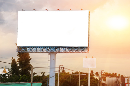 blank white billboard at sunset - can advertisement for display or montage text free space product and business.の写真素材