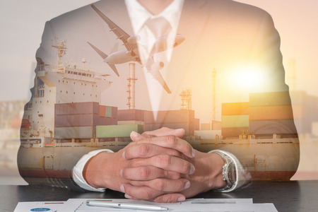 Businessman fingers crossed and sit down, Container Cargo ship, Cargo plane and airplane take off at...