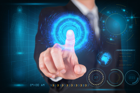 Businessman give a thumbs up for scanning finger security futuristic hi-tech as technology and innovation concept.の写真素材