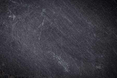Dark grey and black slate background or textureの写真素材