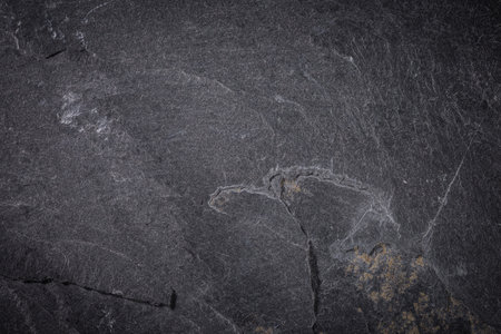 Dark grey and black slate background or textureの写真素材