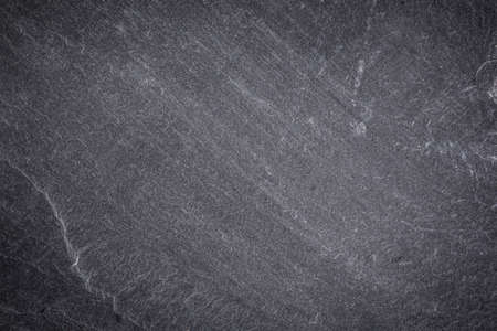 Dark grey and black slate background or textureの写真素材