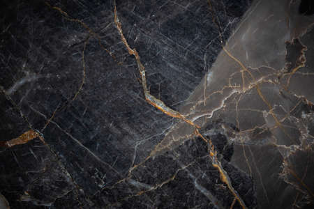 White and yellow patterned natural detailed of dark gray marble (Russia Gold) texture background for interior or product designの写真素材