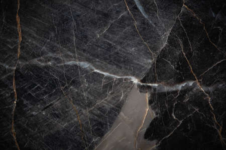 White and yellow patterned natural detailed of dark gray marble (Russia Gold) texture background for interior or product designの写真素材