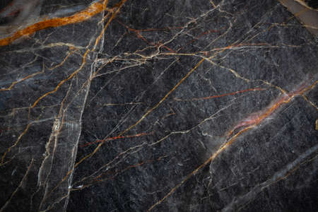 White and yellow patterned natural detailed of dark gray marble (Russia Gold) texture background for...