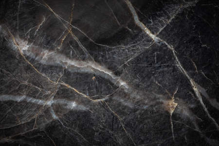 White and yellow patterned natural detailed of dark gray marble (Russia Gold) texture background for interior or product designの写真素材