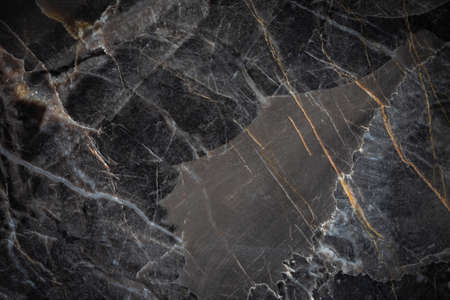 White and yellow patterned natural detailed of dark gray marble (Russia Gold) texture background for interior or product designの写真素材