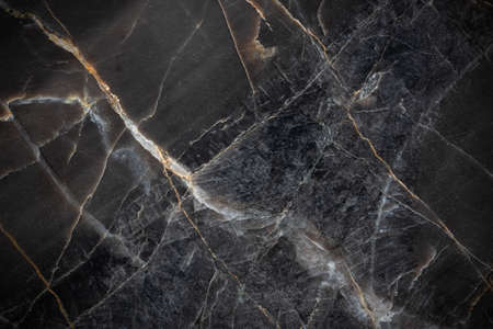 White and yellow patterned natural detailed of dark gray marble (Russia Gold) texture background for interior or product designの写真素材