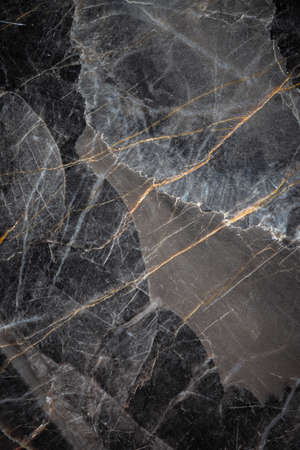 White and yellow patterned natural detailed of dark gray marble (Russia Gold) texture background for interior or product designの写真素材