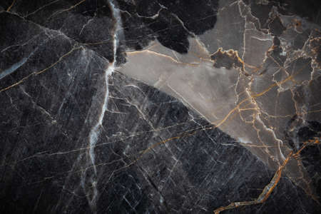 White and yellow patterned natural detailed of dark gray marble (Russia Gold) texture background for interior or product designの写真素材