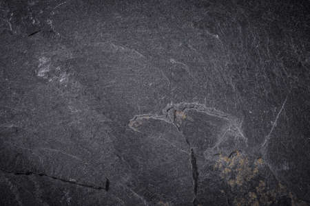 Dark grey and black slate background or textureの写真素材
