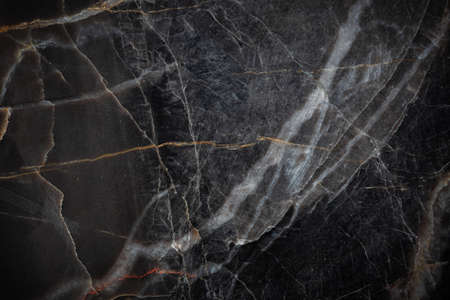 White and yellow patterned natural detailed of dark gray marble (Russia Gold) texture background for interior or product designの写真素材