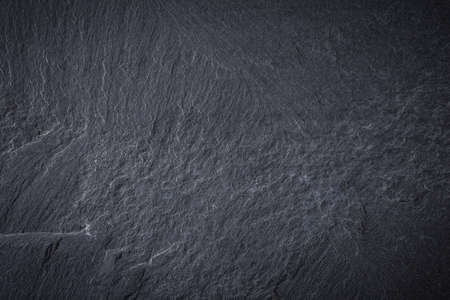 Dark grey and black slate background or textureの写真素材