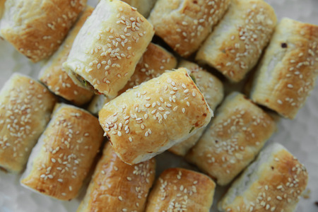 Homemade sausage rolls on white plateの写真素材