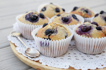 Homemade wholemeal coconut blueberry muffins with silver spoonの写真素材