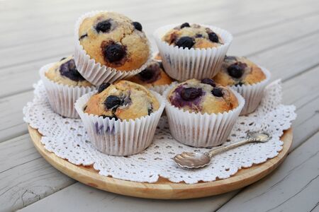 Homemade wholemeal coconut blueberry muffins with silver spoonの写真素材