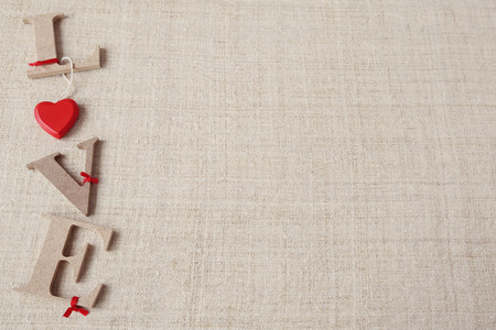 "Love" word on linen background, selective focus, vintage toneの写真素材