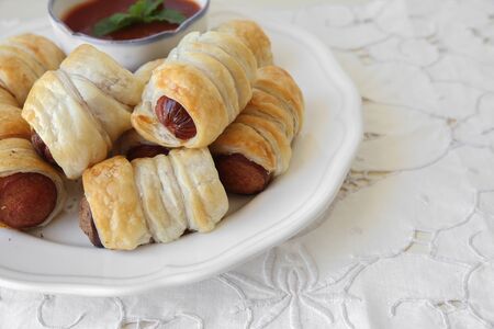 Homemade mini sausage rolls, selective focus, copy space backgroundの写真素材