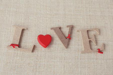 "Love" word on linen background, selective focus, vintage toneの写真素材