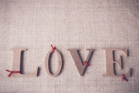 "Love" word on linen background, selective focus, toningの写真素材