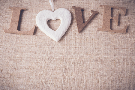 "Love" word on linen background, selective focus, toningの写真素材