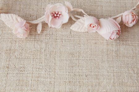 Artificial rose flowers on linen, copy space background, selective focus, vintage toneの写真素材