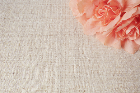 Artificial orange flowers on linen, copy space background, selective focus, vintage toneの写真素材
