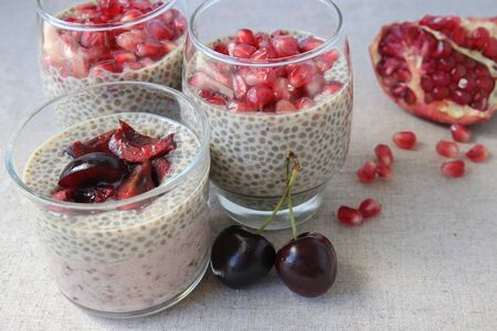 Chia seeds pudding with pomegranate and cherries, selective focusの写真素材