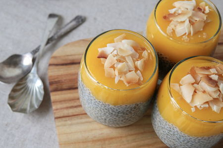 Homemade Chia seed pudding with mango and  coconut flakes, selective focusの写真素材