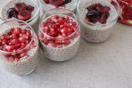Chia seeds pudding with pomegranate and cherries, selective focusの写真素材