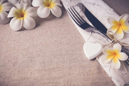 Plumeria Frangipani flower Table setting copy space background, selective focus, toningの写真素材