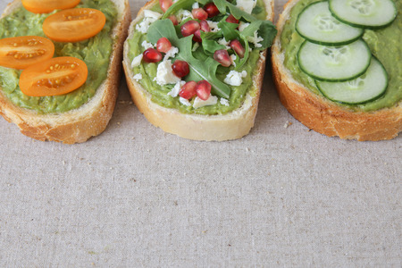 Mixed green sourdough open face sandwiches toast,toningの写真素材