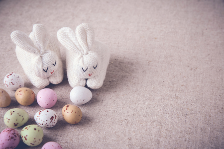 Easter pastel speckled eggs and bunny, selective copyspace background, toningの写真素材